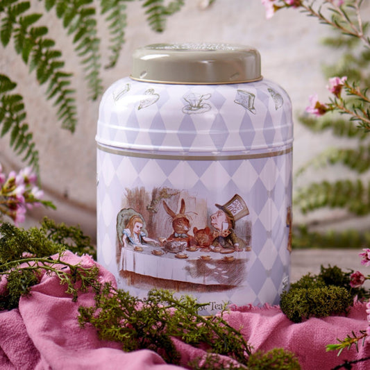With quotes and illustrations from the original tale, this Alice in Wonderland tea caddy features drawings of Alice, the Mad Hatter, The Dormouse, The March Hare, The Playing Cards, and The White Rabbit. Enjoy our signature English Breakfast blend -