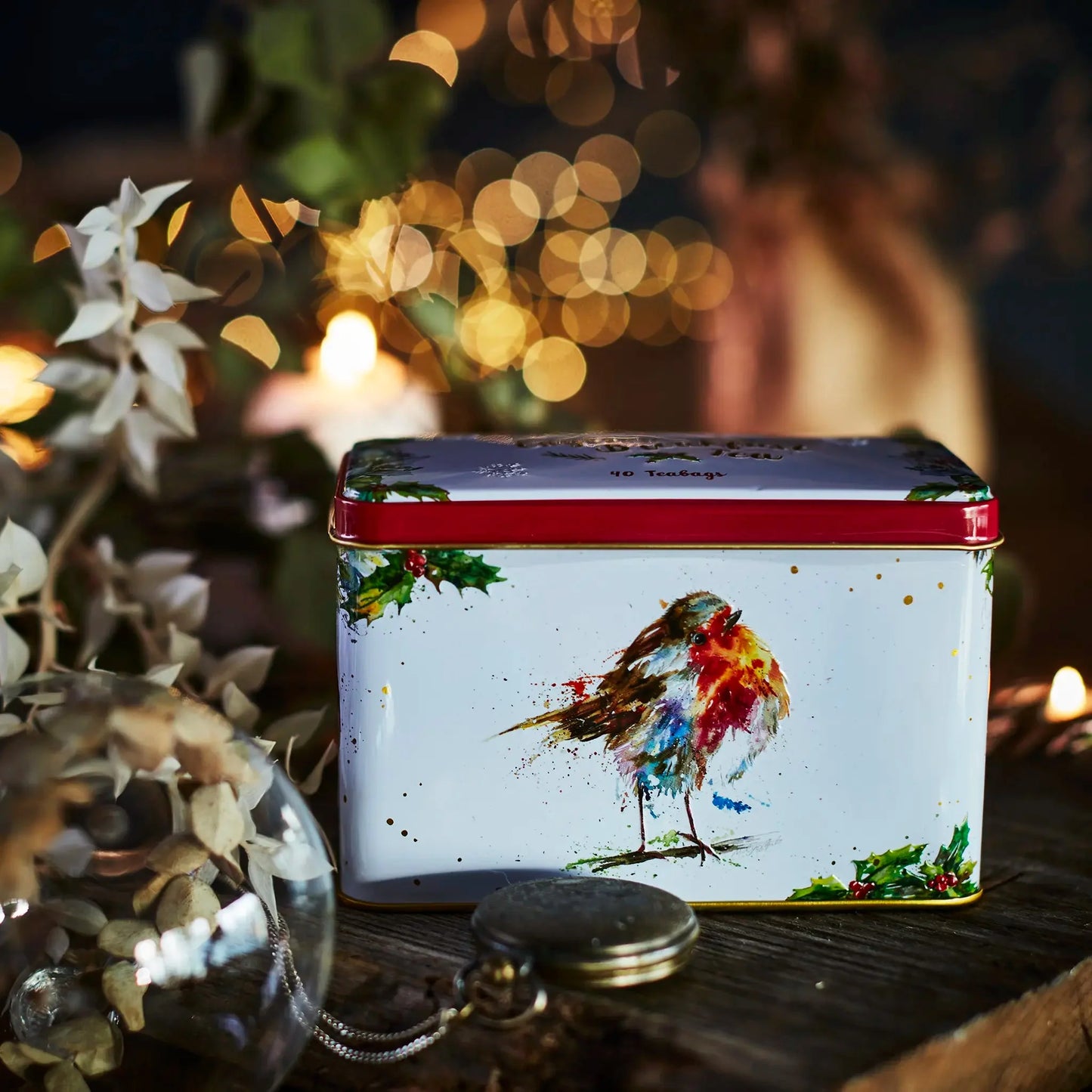 Our festive Christmas robin tea tin is titled 'Thinking of You' and is an original painting by Nicola Rowles. Nicola creates animal art in her own unique style using her knowledge of different painting techniques. This little robin was created using