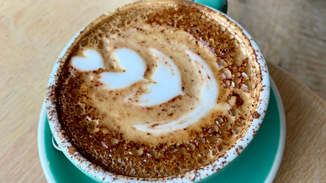 Latte art in blue mug - Tiered tulip