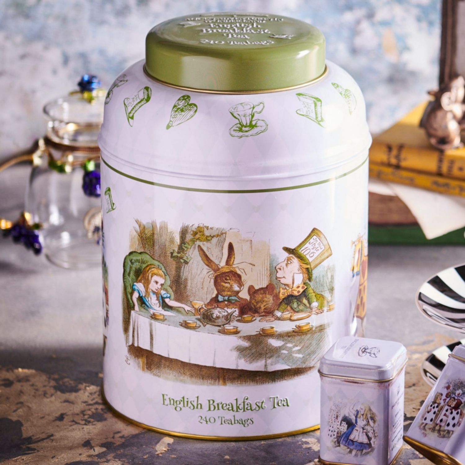 With quotes and illustrations from the original tale, this Alice in Wonderland themed large round tea caddy features drawings of Alice, the Mad Hatter, The Dormouse, The March Hare, The Playing Cards, and The White Rabbit. Enjoy our signature English