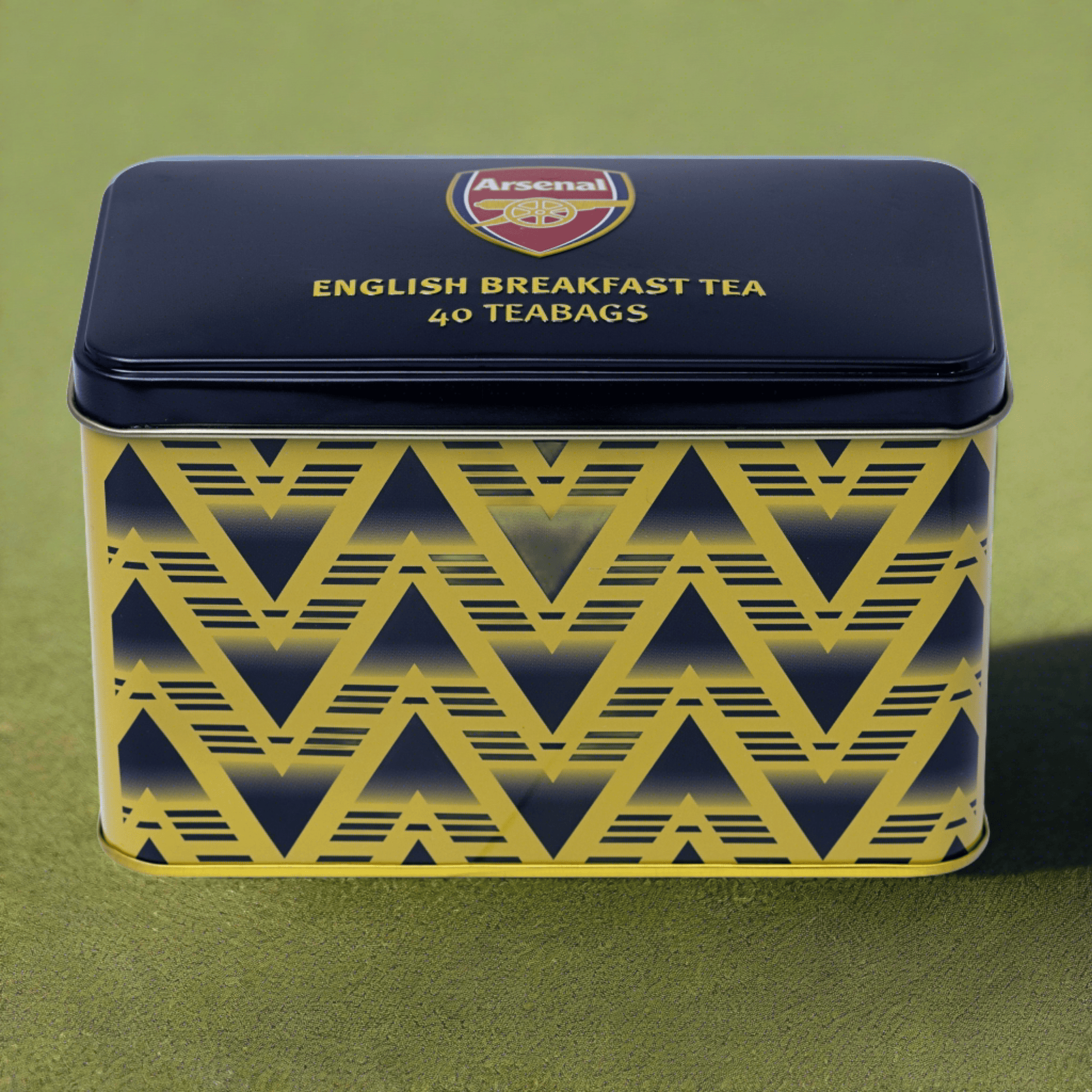 Our officially licensed Arsenal Football Club Bruised Banana Tea Tin. A collectible tea tin celebrating Arsenal Football Club in a wonderfully artistic style. Perfect for fans and collectors, featuring a holographic emblem of authenticity. True tea-d