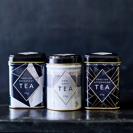 Celebrate your loved one with this Art Deco Gift Set of three Mini Tea Tins! The charming monochrome design and gold accents will add an elegant touch to any home, complete with 3 different loose-leaf teas for a decadent afternoon indulgence. Perfect