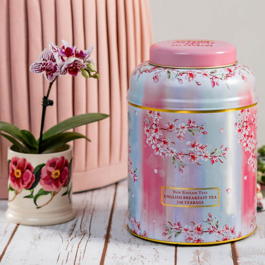 A Watercolour Cherry Blossom design featuring illustrations of the ephemeral Cherry Blossom tree in flower. This Large Tea Caddy celebrates the natural beauty of the Cherry Blossom and its blooms, and contains 240 of our popular English Breakfast Tea