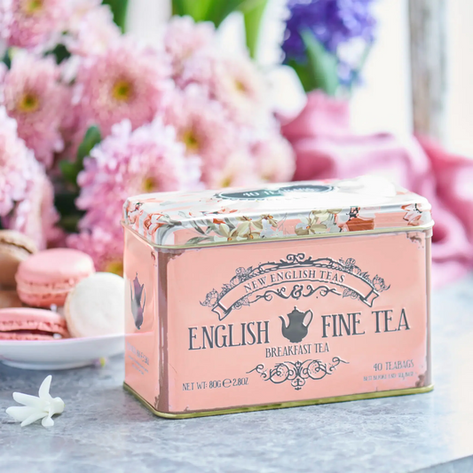 Experience the timeless sophistication of this Vintage Floral Classic Tea Tin. Crafted with hinged flip lid and blush in colour, it is adorned with vintage style typography and floral motifs, adding a delicate touch to your tea time. Enjoy a refreshi