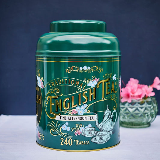 A stylish bottle-green tea caddy featuring Victorian teaware and intricate gold embossing. Highly collectible, this stylish tea tin contains our popular English Afternoon Tea. The ideal gift!