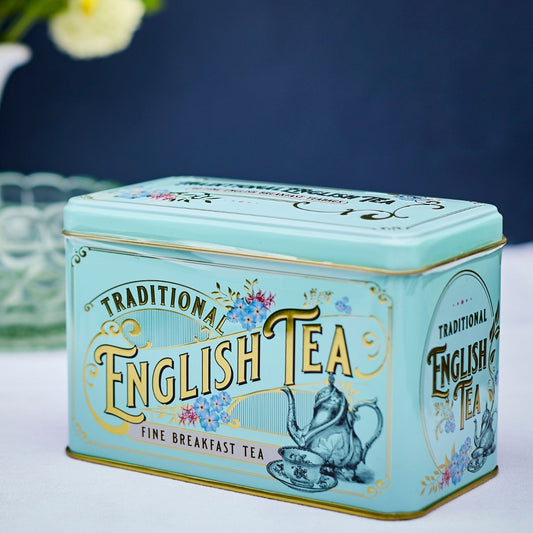 The Vintage Victorian Classic tea tin in Mint Green. This vintage-inspired design features Victorian-era teaware illustrations, gold detailing, embossing and azure blue Forget-Me-Not florals, which became a symbol of love and remembrance during the V