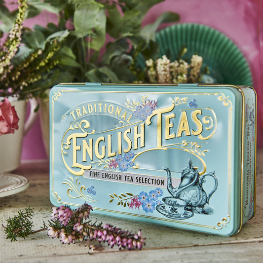 A stylish mint-green tea caddy featuring Victorian teaware and intricate gold embossing. Highly collectible, this stylish tea tin contains our popular English Breakfast teabags, English Afternoon teabags, and Earl Grey teabags. The ideal gift! Tea Ca